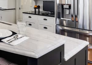 White Macaubas Quartzite on the island top appears to be marble but is a much harder and easy care counter than marble. White Macaubas Quartzite on the island top appears to be marble but is a much harder and easy care counter than marble.