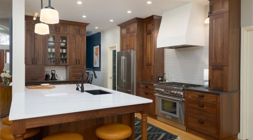 A kitchen rebuilt with all-new cabinetry and surfaces on the same footprint