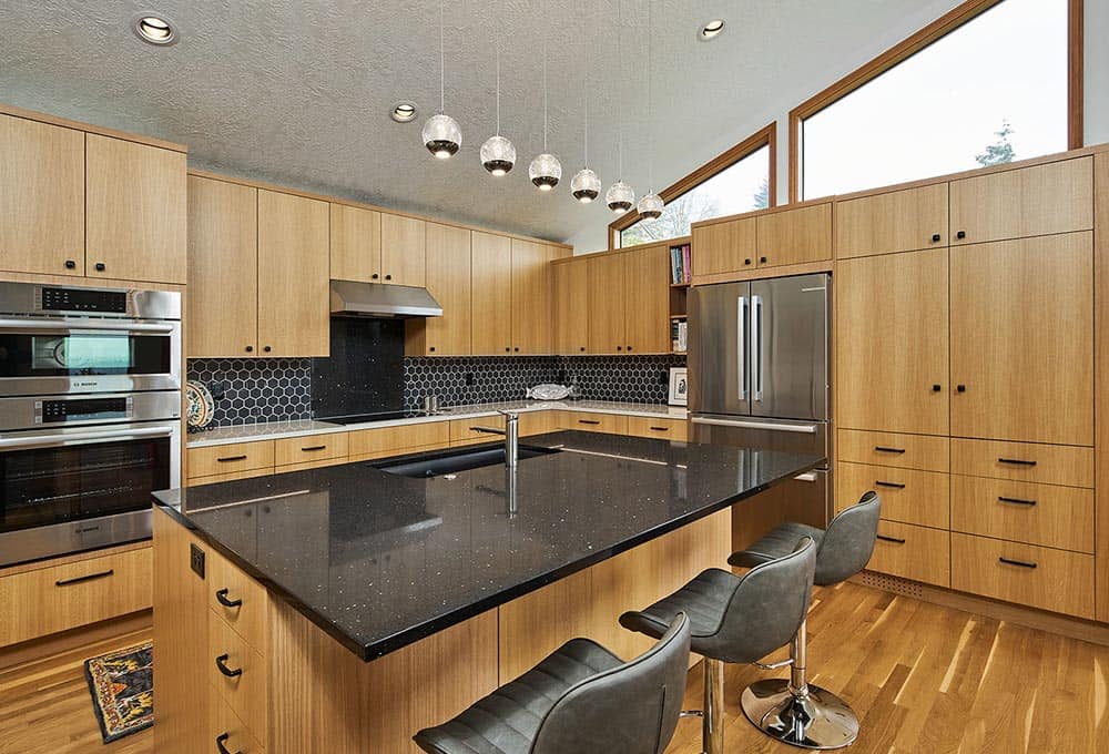 Open concept vaulted kitchen in Portland with island