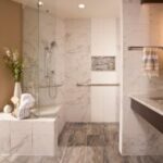 Completed contemporary bathroom remodel with tiled shower, the project's after view