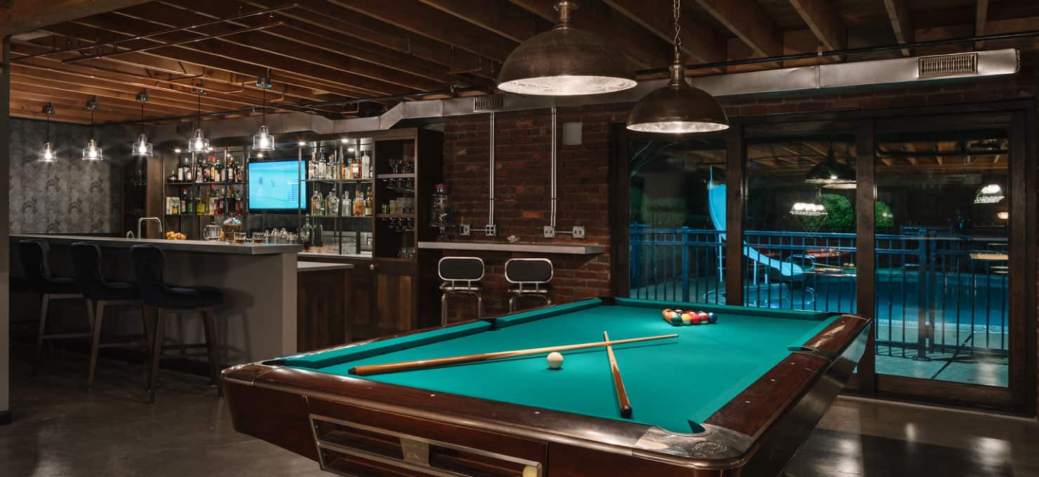 basement with billards table and bar