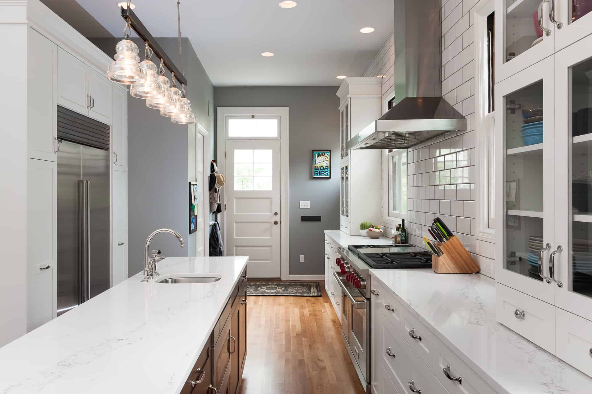 Modern farmhouse kitchen with white cabinets and stainless steel appliances