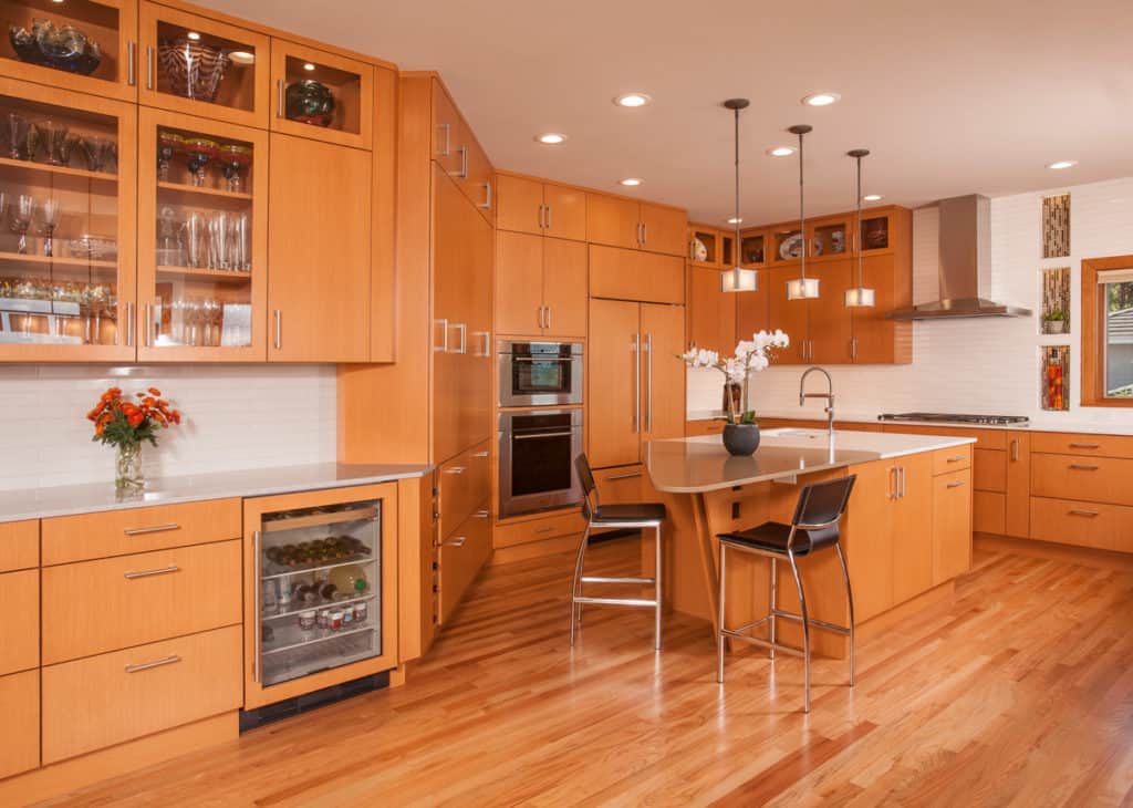 Two-tone countertop that highlights the workspace and eating areas.