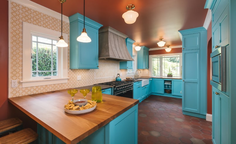 Bright blue kitchen cabinets with contrasting earth tones home remodel