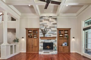 Fireplace placed in between two doors in a living room.