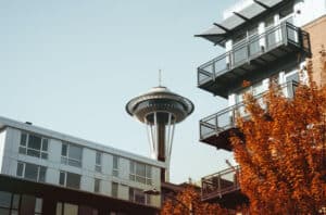 View of the Seattle Space Needle next to an apartment building.