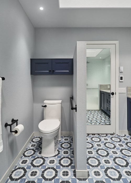 Accessible toilet area with support bar.