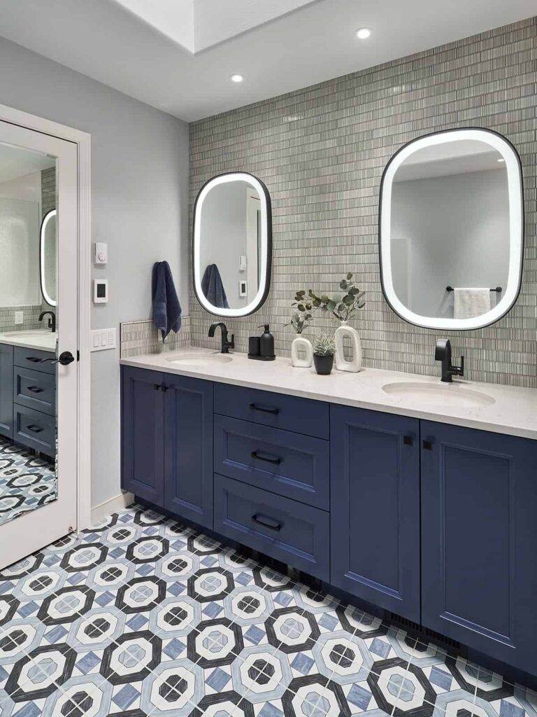 Blue cabinets in a transitional bathroom design