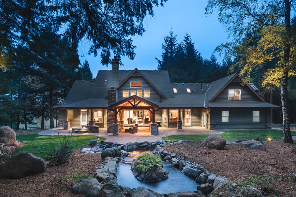 Outdoor living area remodel with cultured stone, timber frame, and fireplace.