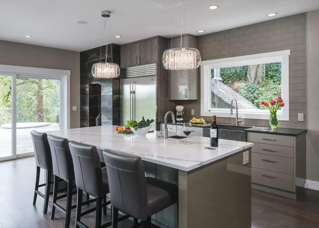 Grey subway tile in a modern kitchen with a central island.