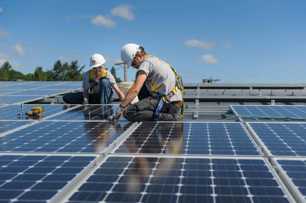 Neil Kelly installs solar panels at a Salem, Oregon rehabilitation center.