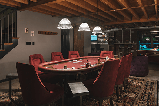 Cozy basement space with poker table and bar