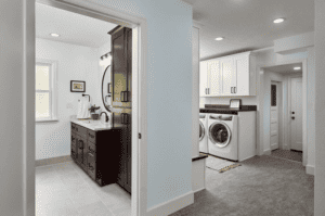 A garage conversion that has a bathroom and laundry space for a washer and dryer.