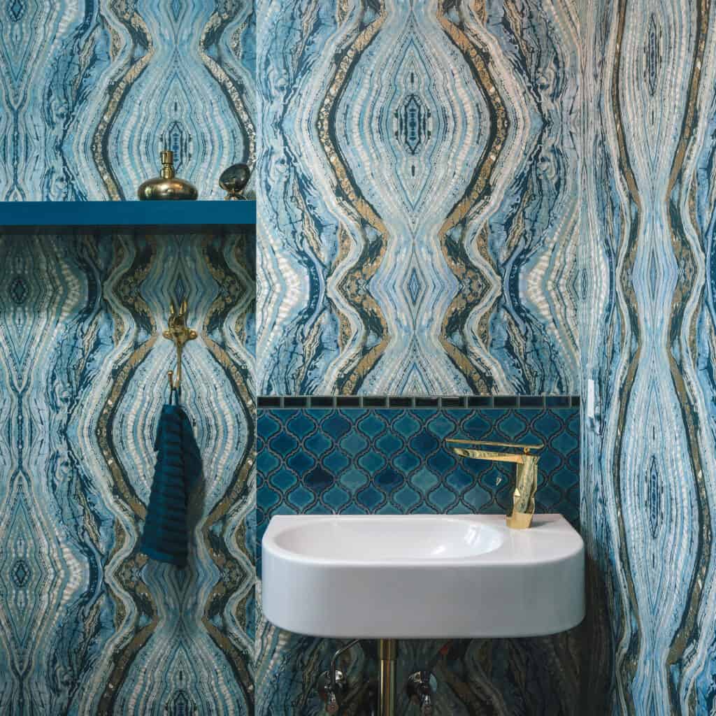 Printed wall paper makes a statement, especially in half-baths and powder rooms.