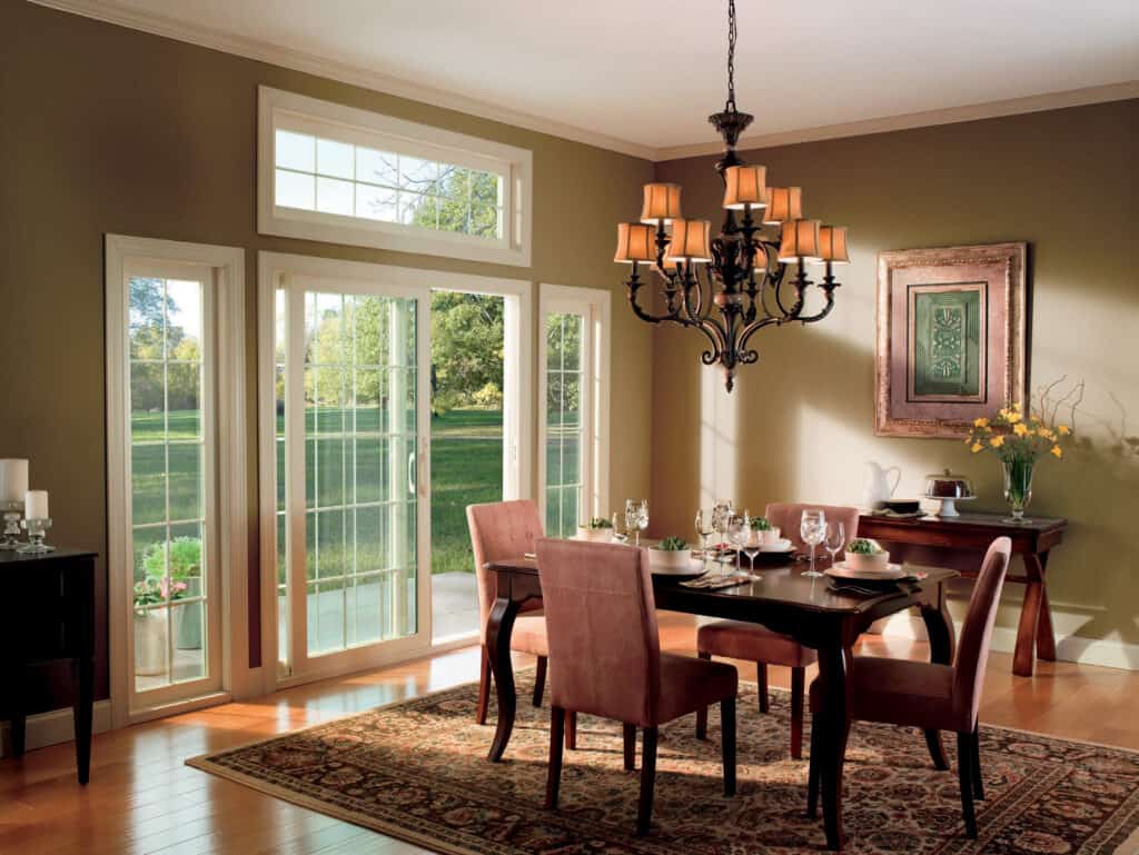 Matching windows surround a sliding glass door