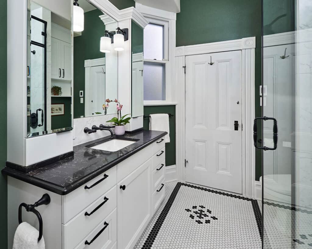 Small Transitional Bath in Northwest Portland, featuring two mirrored cabinets to make the space appear larger.