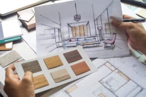 Person looking at wood samples while designing their home remodel.