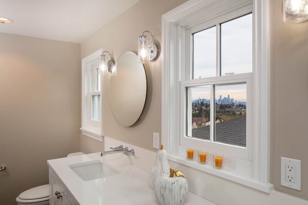 Primary bath featuring view of Seattle in the window.