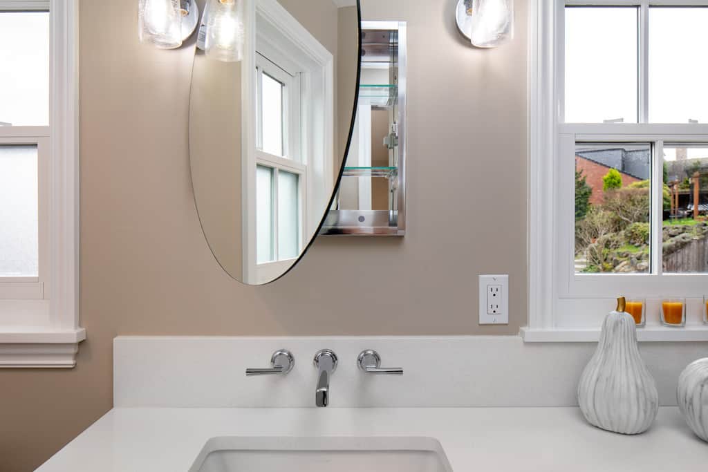 Primary bath: Mirrors open to reveal medicine cabinet.