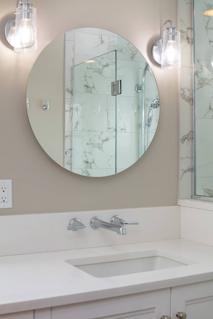 Primary bath: Circular mirrors over the vanity.