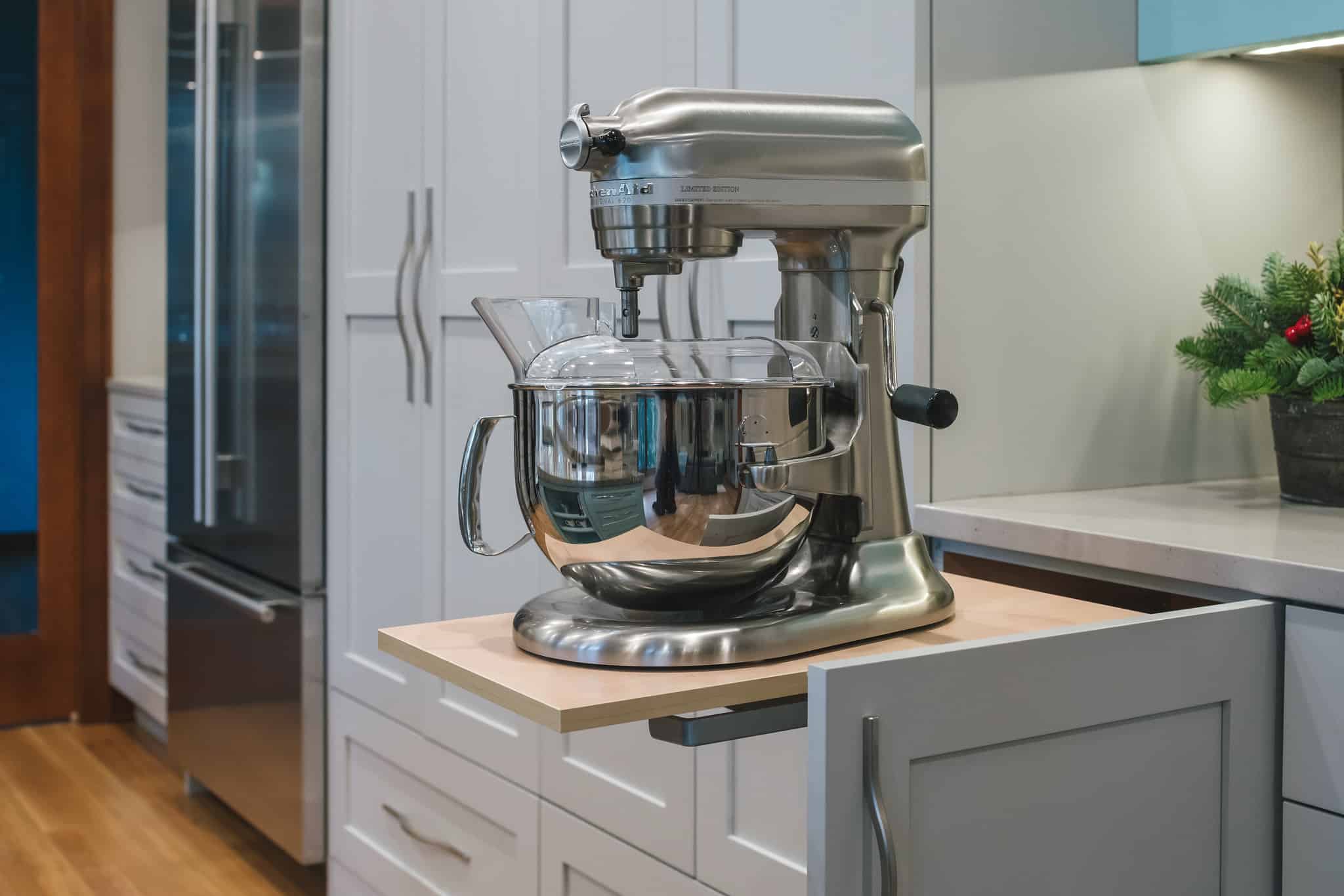 Stand mixer on top of a pull-out counter.