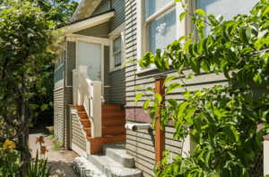 Backyard door and stairs at the rear of a house.