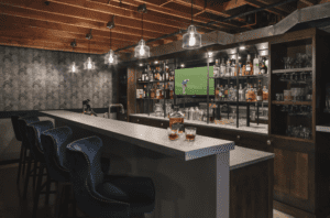 Bar serving area with three stools.