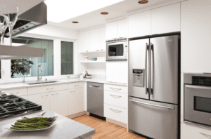 white and wood kitchen with stainless steel appliances.