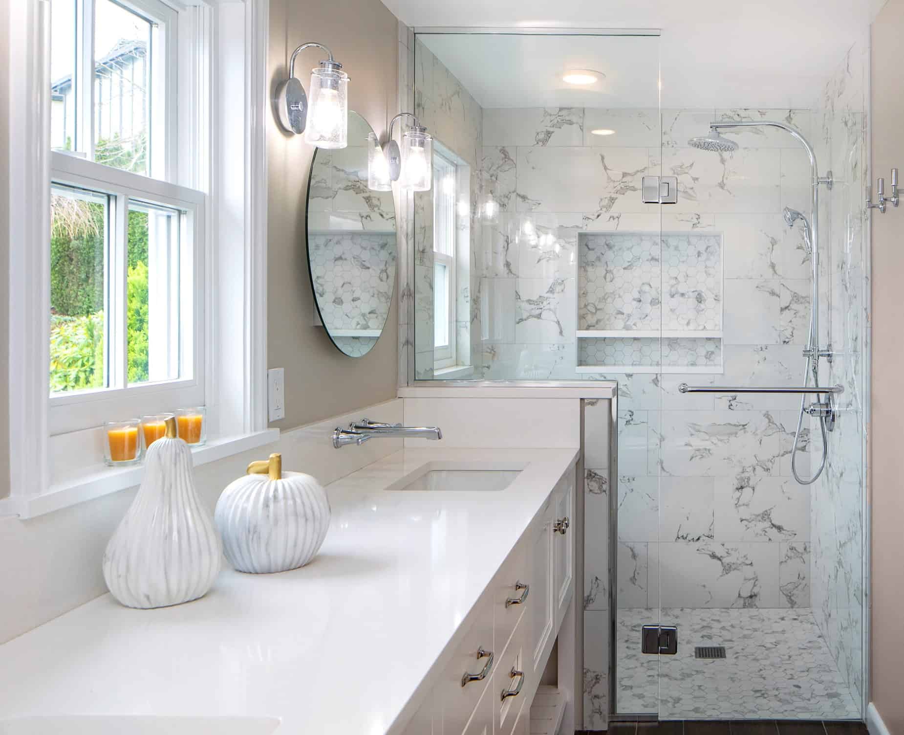 A glass shower enclosure keeps a small bathroom open