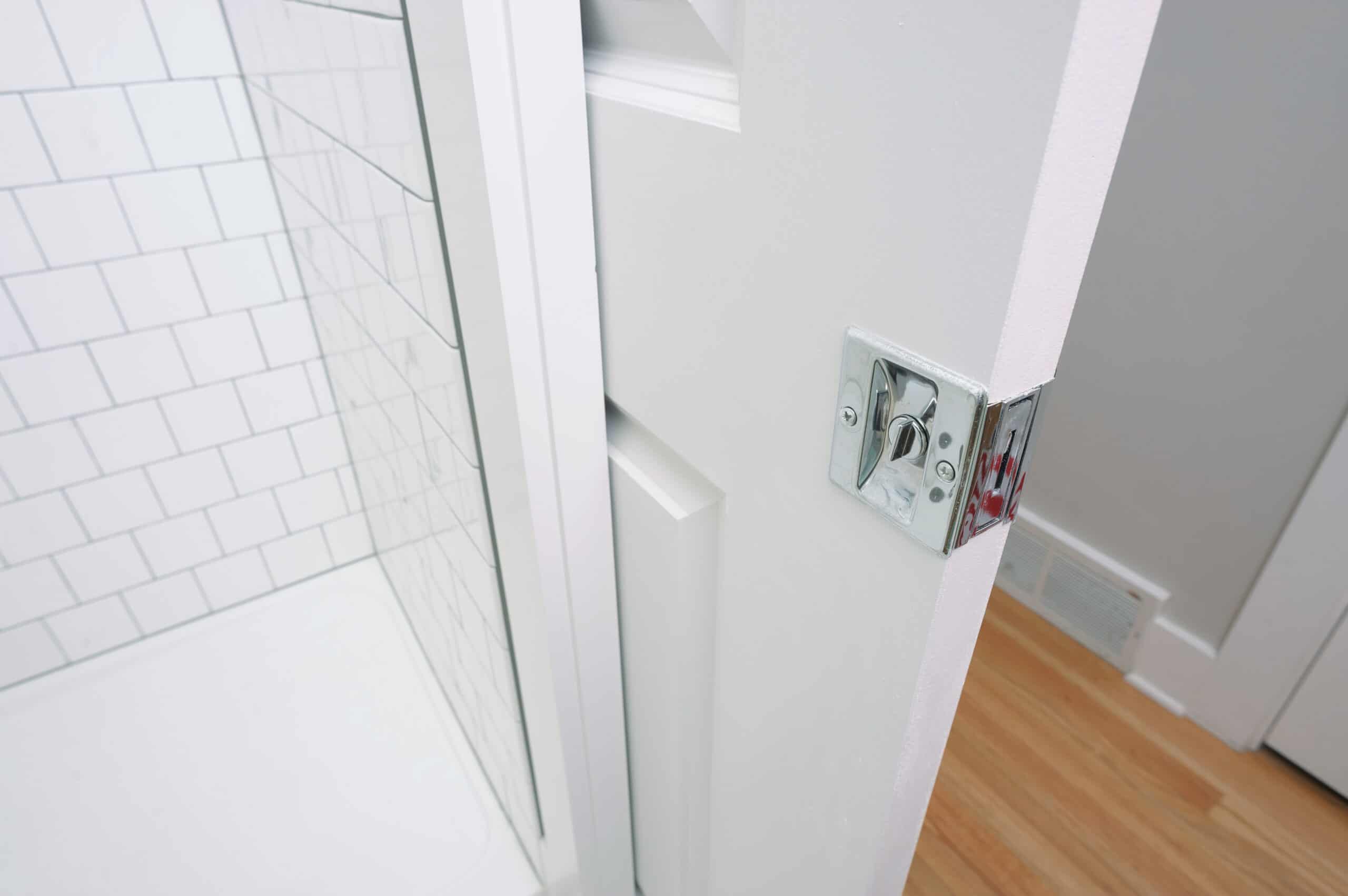 A pocket door saves space in a small bathroom.