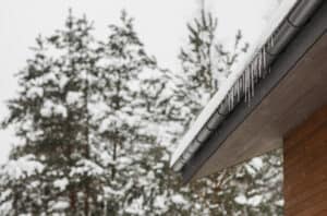 home gutter covered in ice.