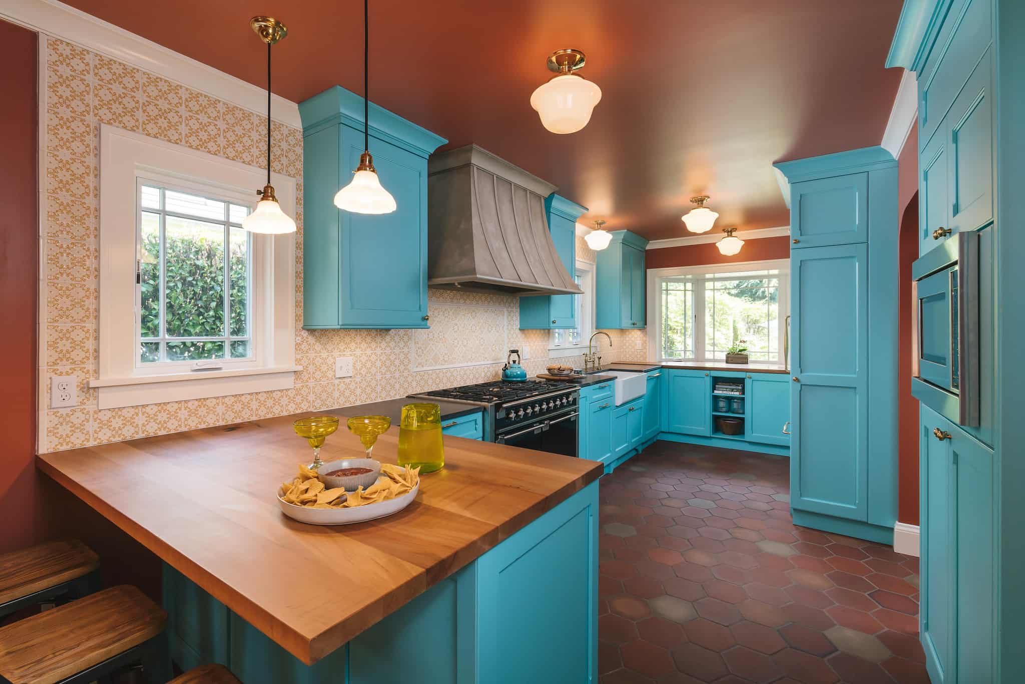 Color, pattern, and lighting create a festive ambiance in this Portland area kitchen
