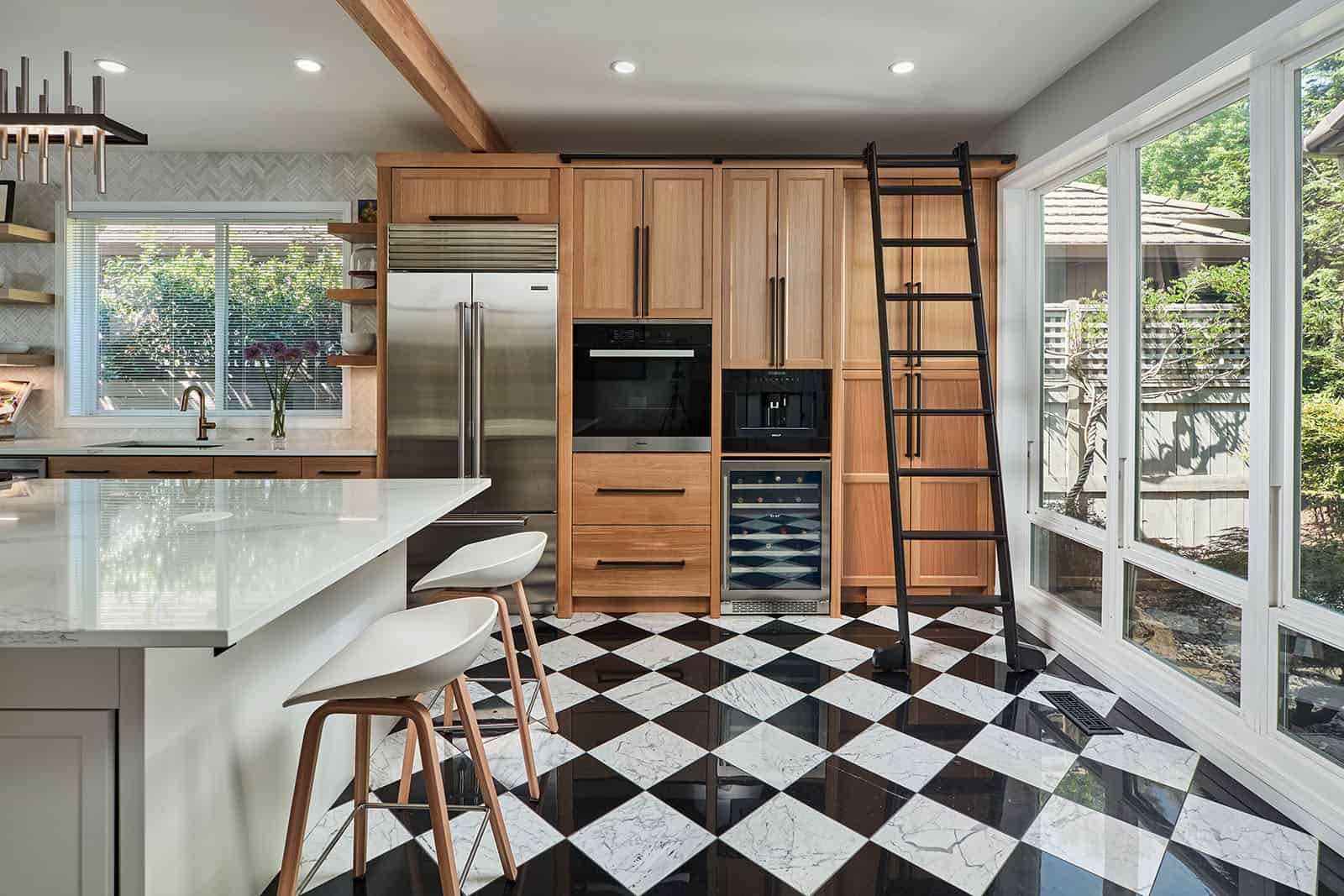 A kitchen with checkerboard tile floor