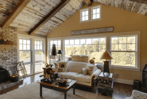 Large living room with a floor to ceiling window.