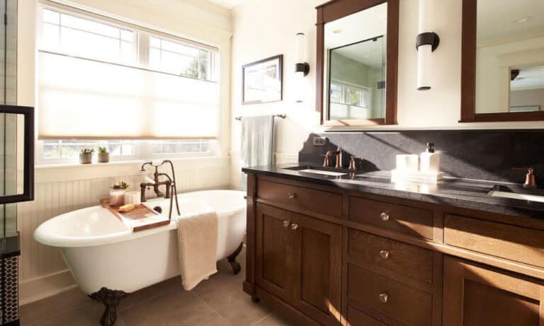 Classic bath with a clawfoot tub and dark wood vanity.)