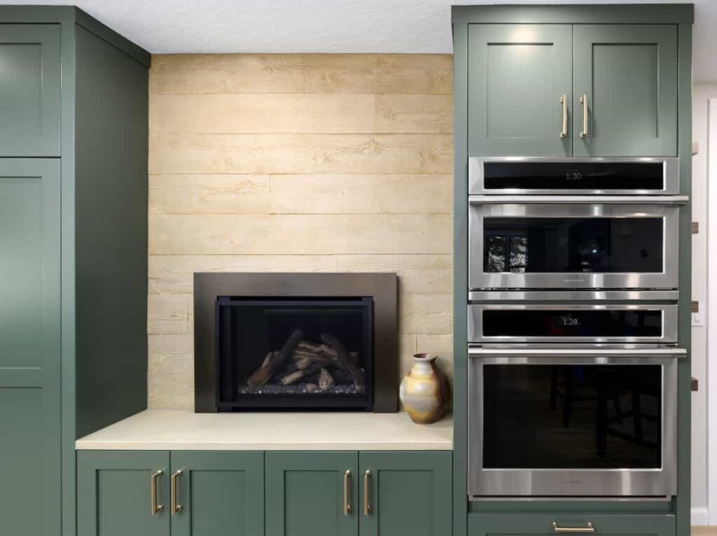 A fireplace in the kitchen - common in older homes but this one is modern