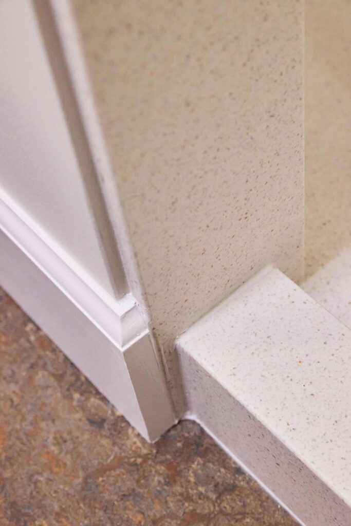 floor and shower surfaces in a remodeled bathroom