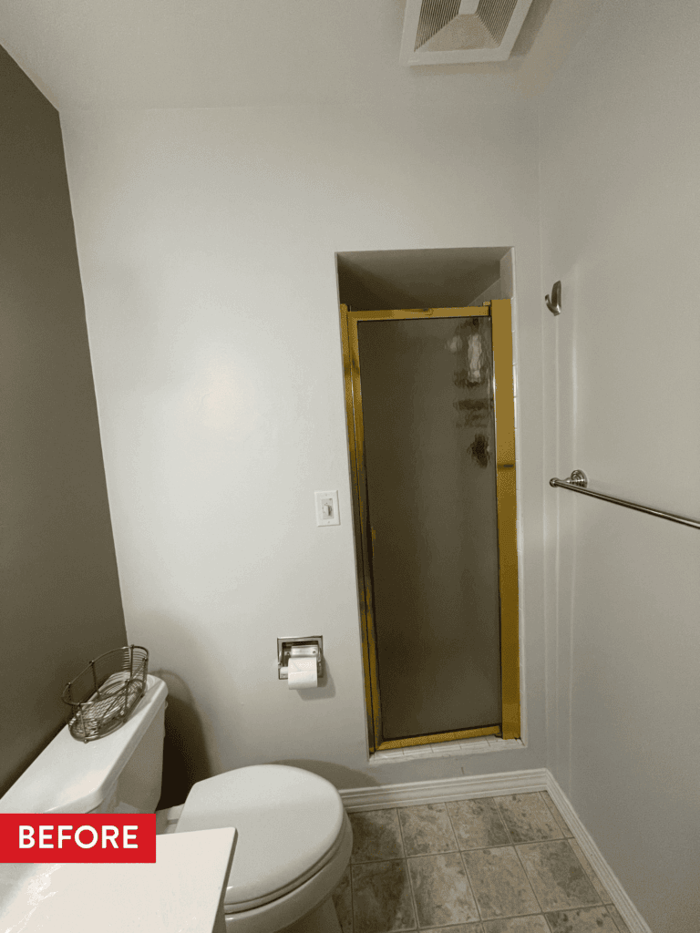 A cramped coffin-style shower before remodeling