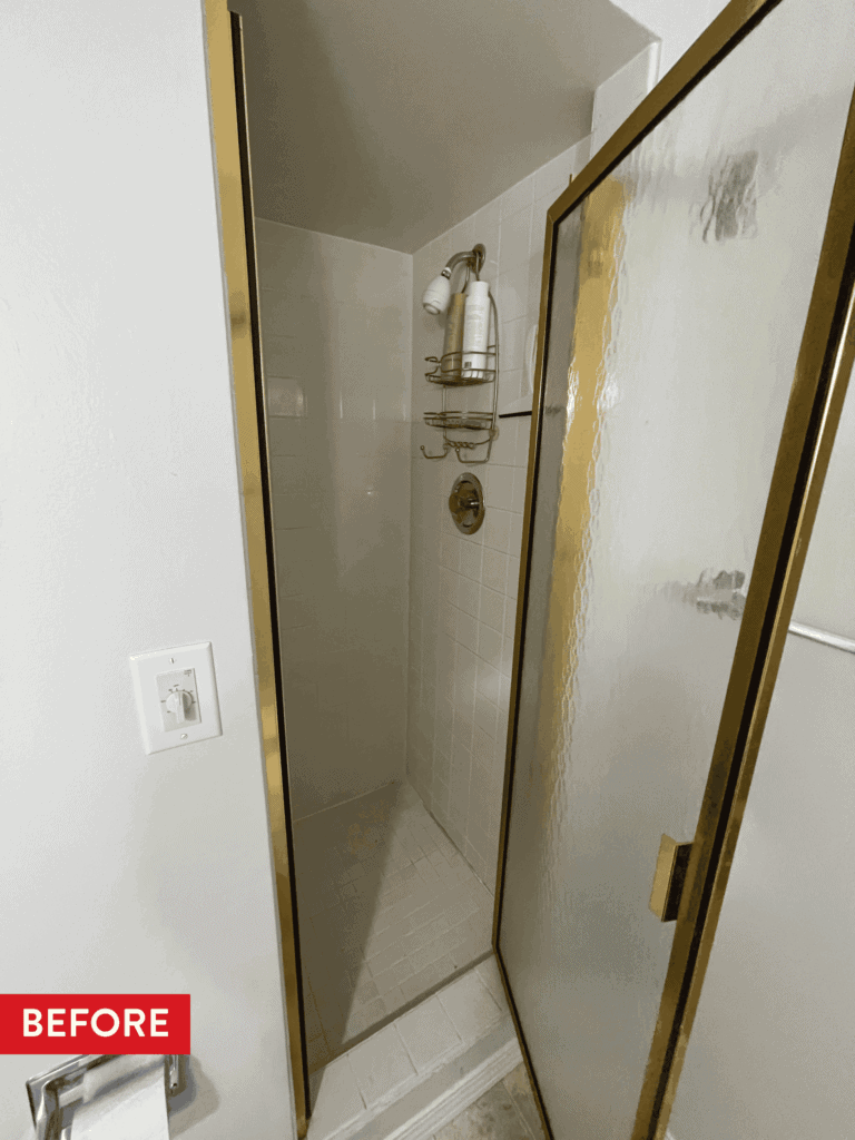 A cramped coffin-style shower before remodeling