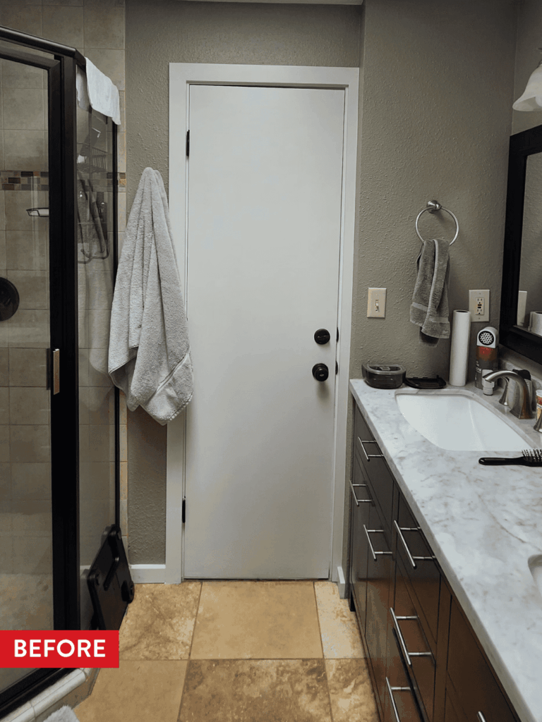 A cramped primary bathroom before remodeling