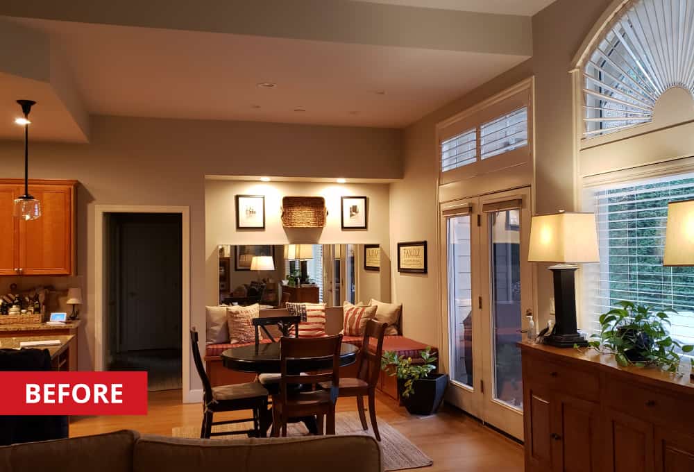 Black round kitchen table in a breakfast-nook.