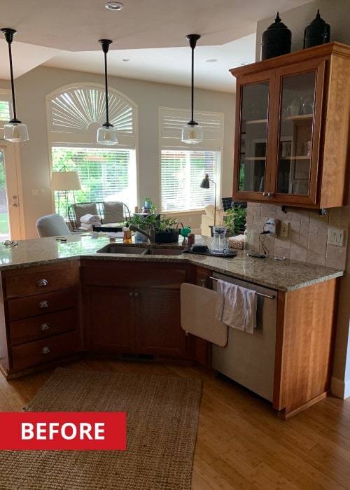 Curved kitchen island with a double-bowl under-mount sink.