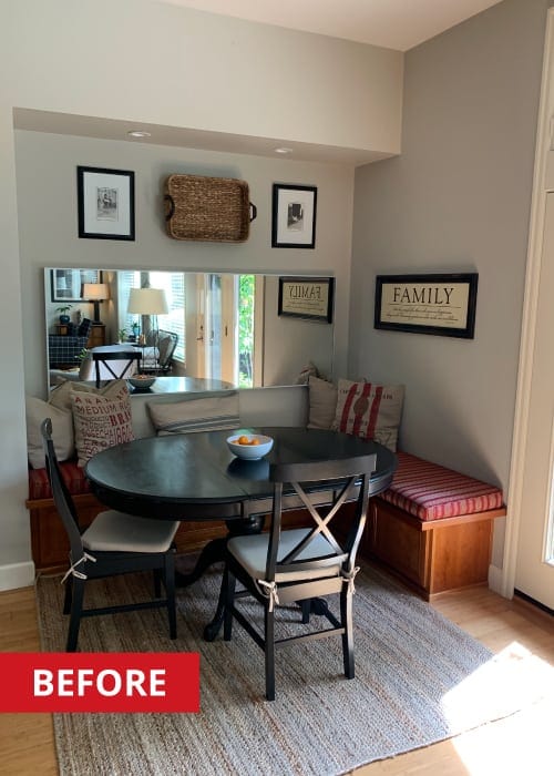 Black round kitchen table in a breakfast-nook.
