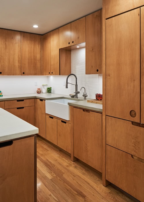 Plywood cabinets and drawers with maple veneer and custom cutouts from Hayes Cabinets.