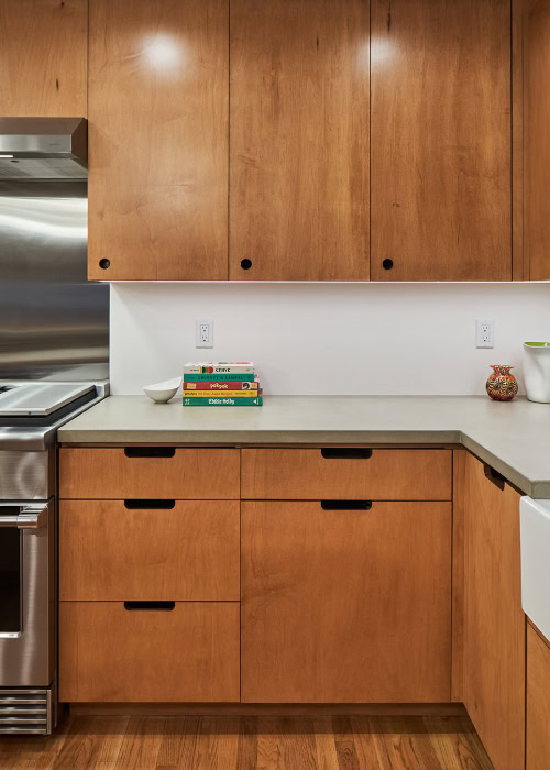 Plywood cabinets and drawers with maple veneer and custom cutouts from Hayes Cabinets.