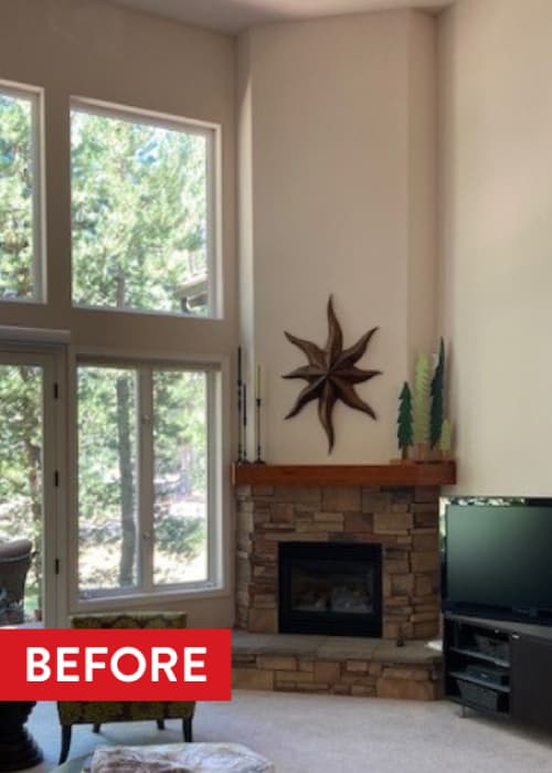 A tall, living room fireplace that is tiled from floor to ceiling in textured tile.