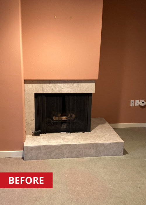 A corner fireplace in a living space.