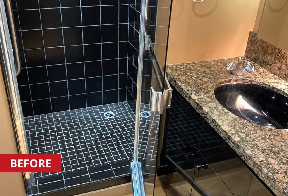 Bathroom shower with black tile.