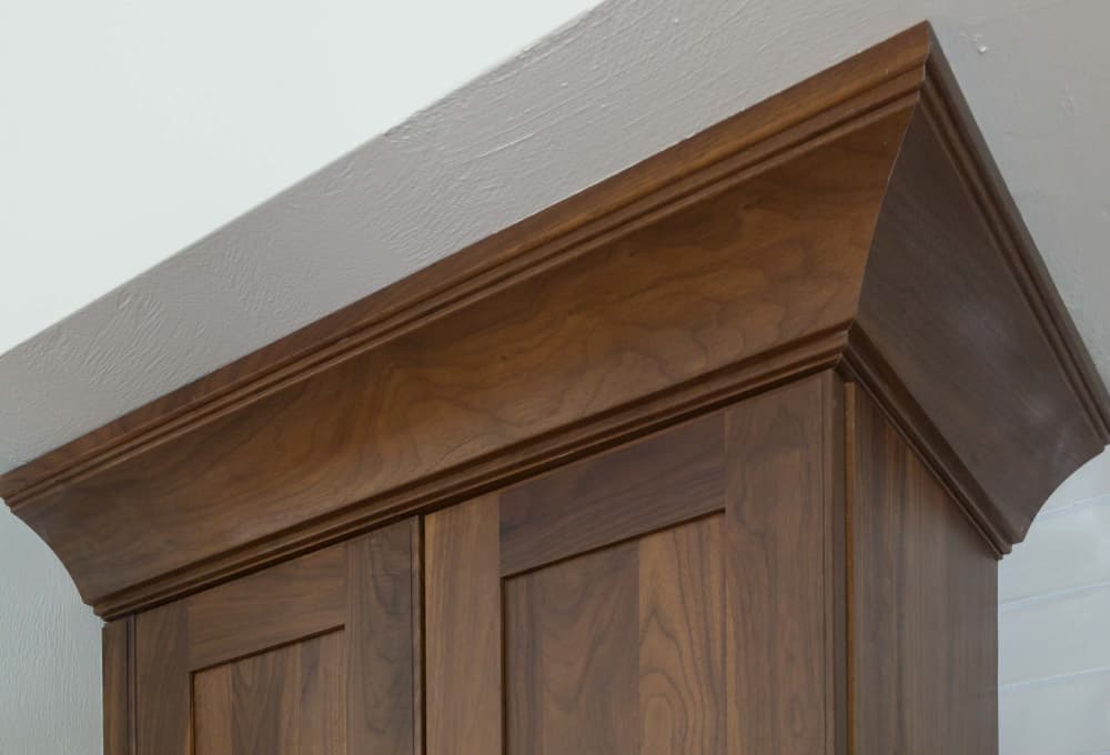 Walnut cabinet towers.