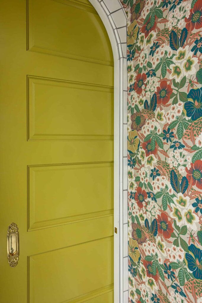 The remodeled primary bathroom water closet pocket door